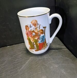 Norman Rockwell White Mug with Gold Rim and Colorful Illustration